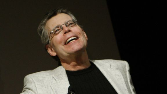 Author Stephen King Holds Up Pink Amazon Kindle 2 At News Conference In New York